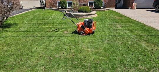 Commercial aerator on residential lawn