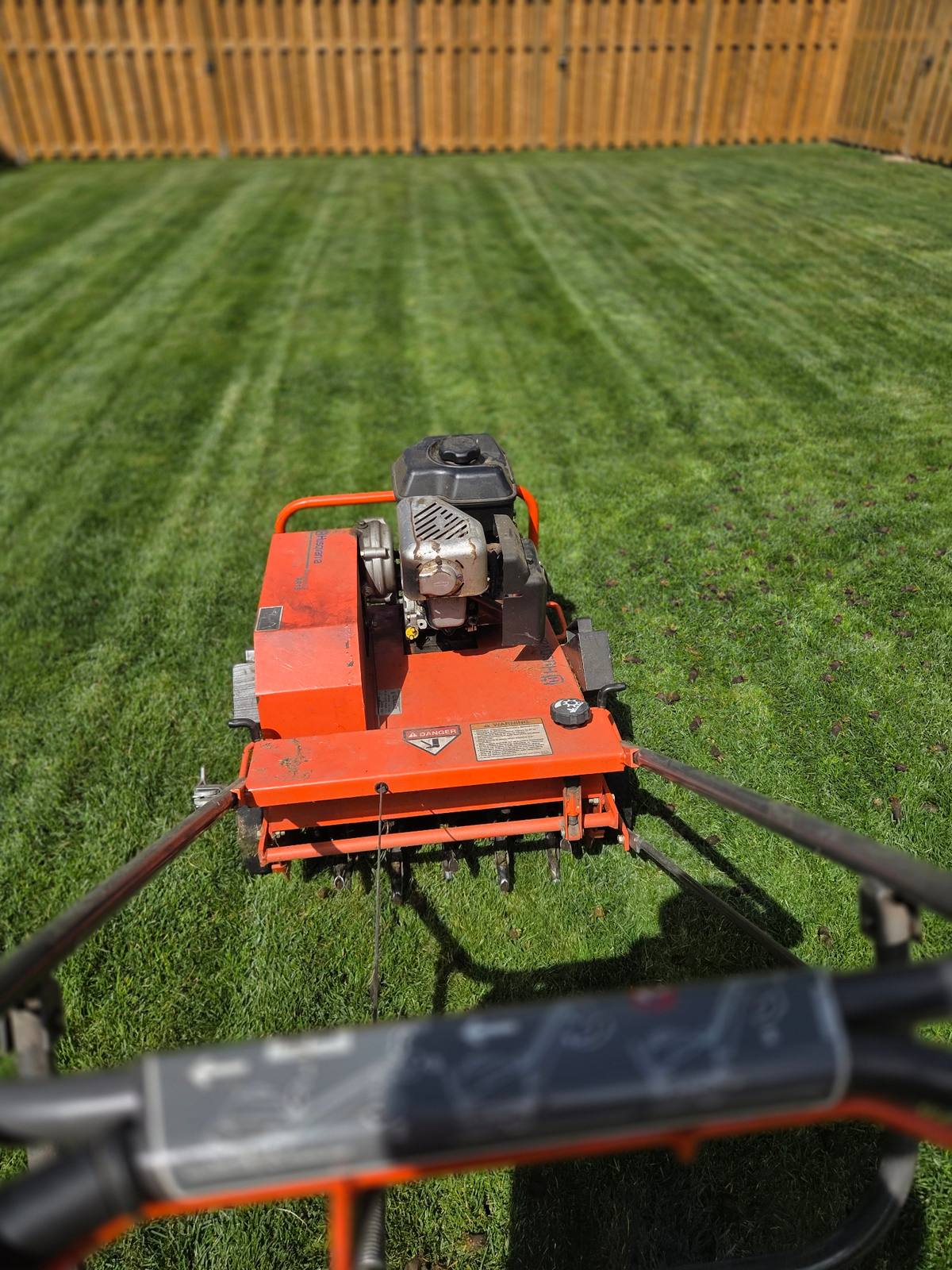 Freshly mowed and striped lawn by Garland's Property Care